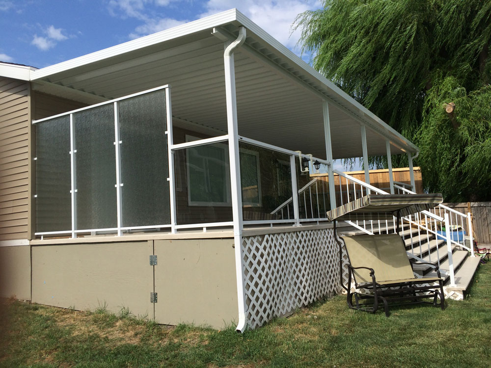 large patio cover with privacy glass on the side