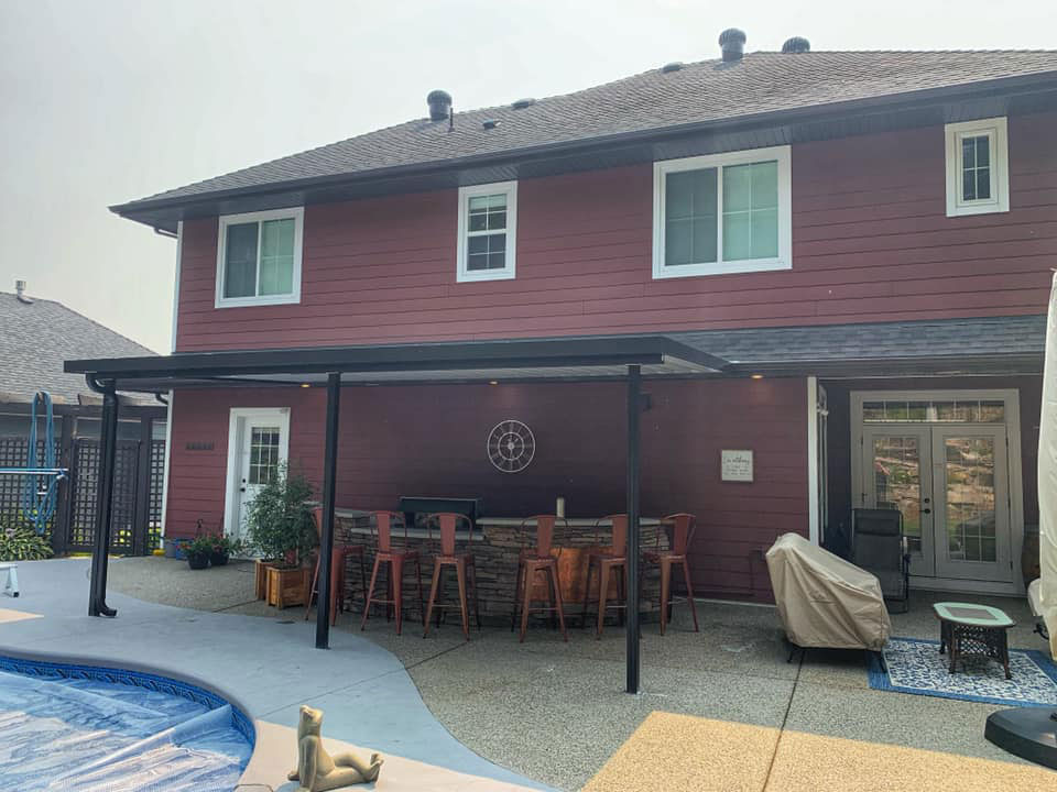black frame patio cover over poolside bar