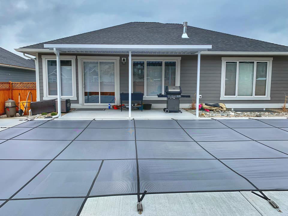 clean lines patio cover beside backyard pool