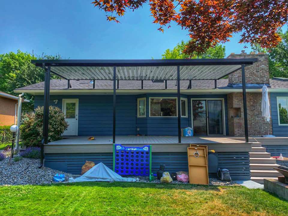 large patio cover on blue house
