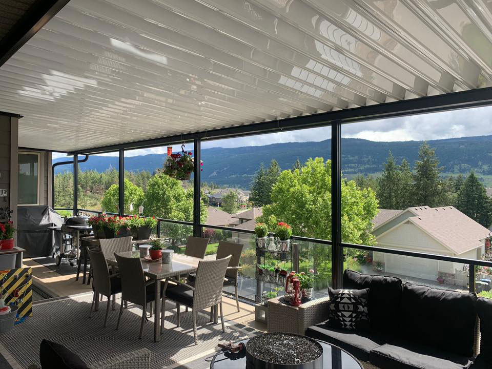 large patio cover with glass railings