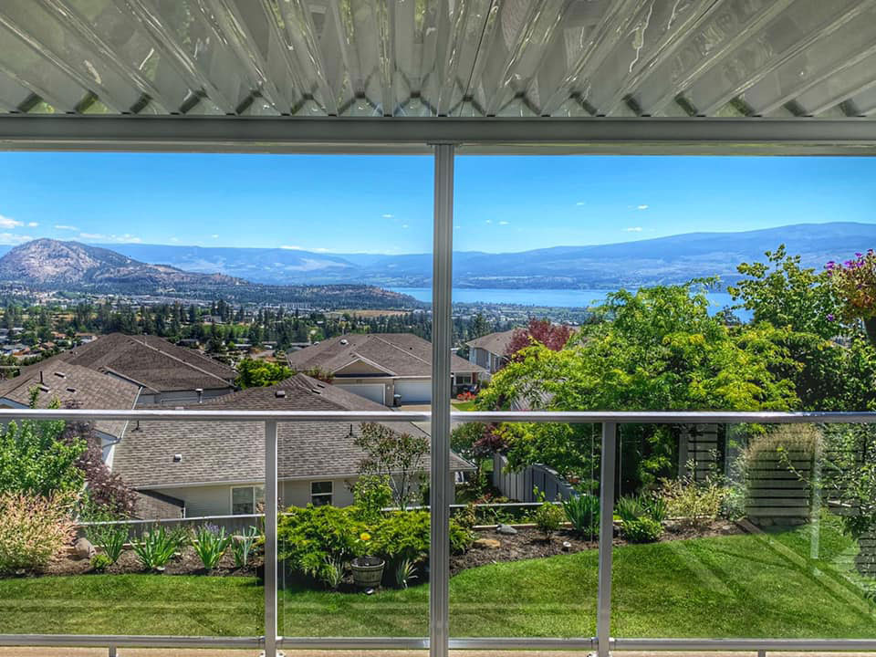 view of okanagan lake from under patio cover