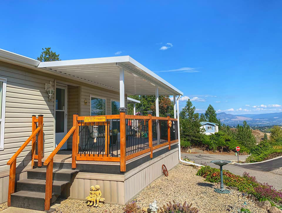 view of side of prefab house with new patio cover