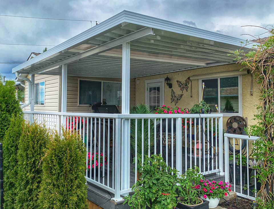 white patio cover on yellow house