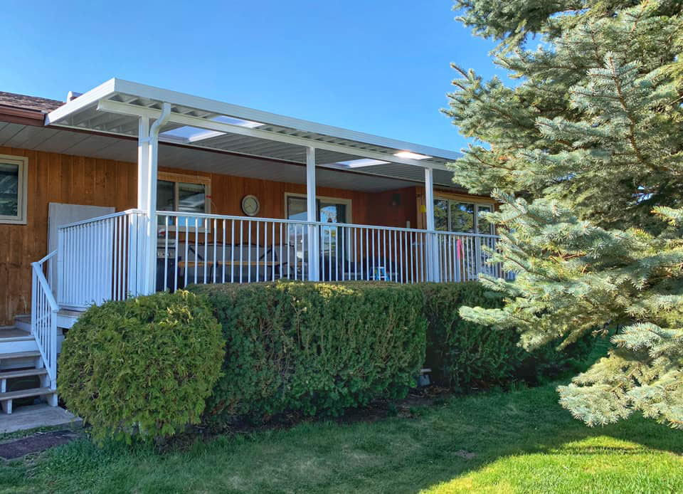 white patio cover with matching white railings