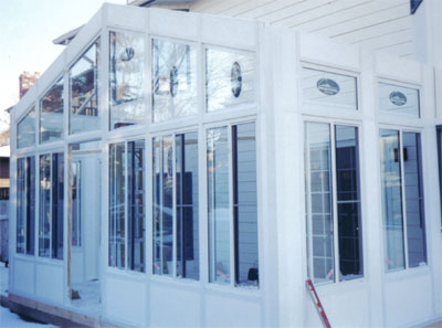 all white aluminum and glass sunroom