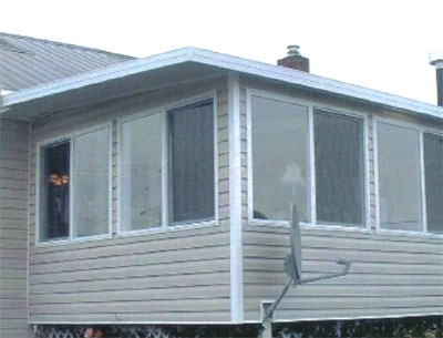 this sunroom is like an addition to the house
